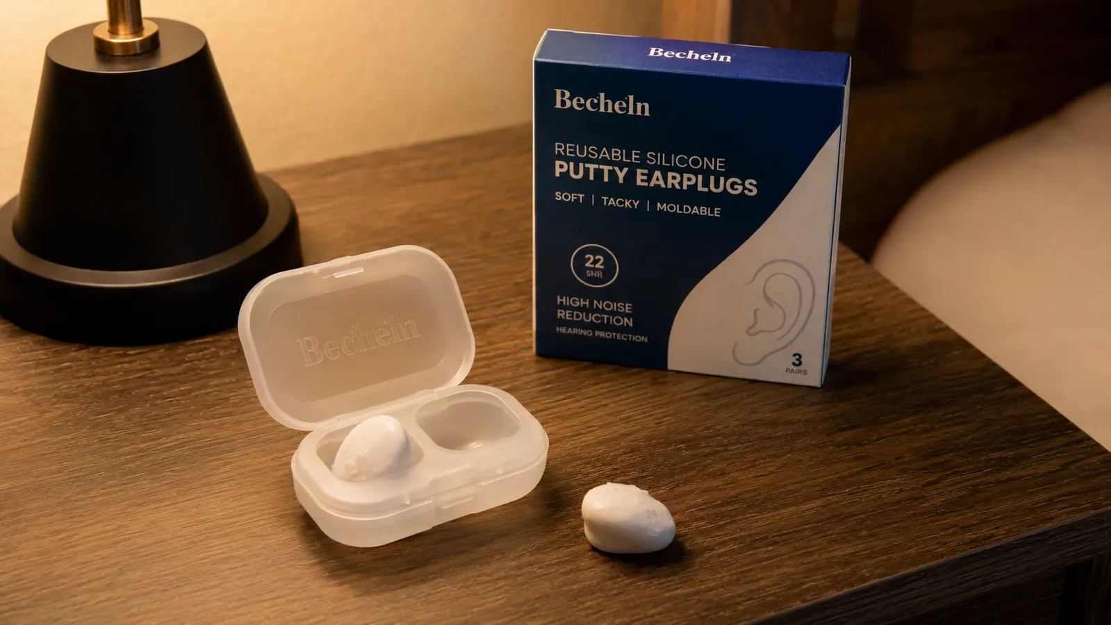 Hand holding the Becheln silicone earplugs case open next to a slightly tacky, dust-flecked used earplug